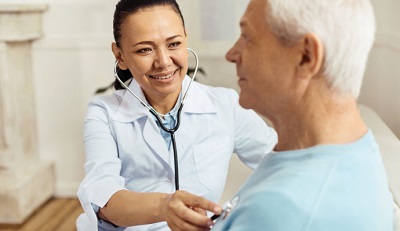 picture of an elderly lady consulting with a pleasant specialist doctor